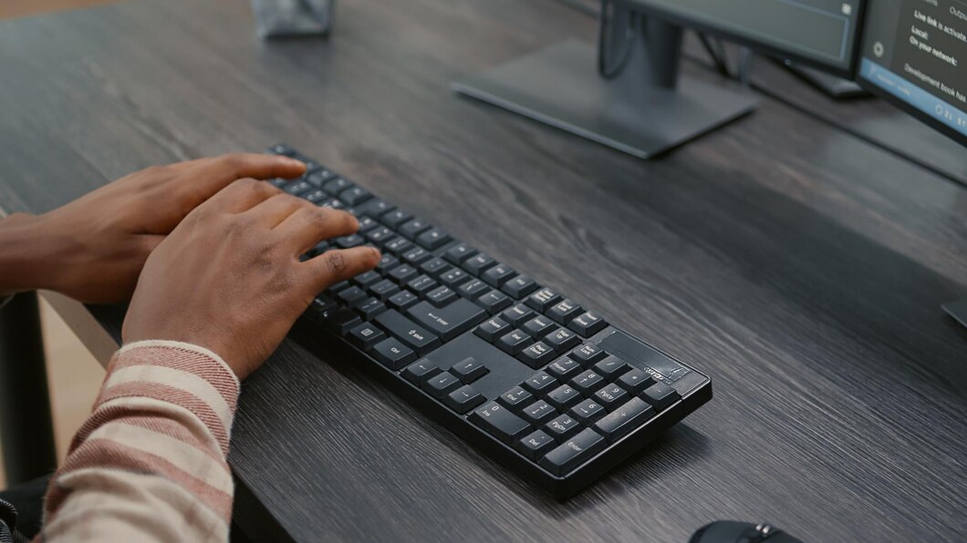 a person working on Logitech K400 Plus Wireless Touch Keyboard